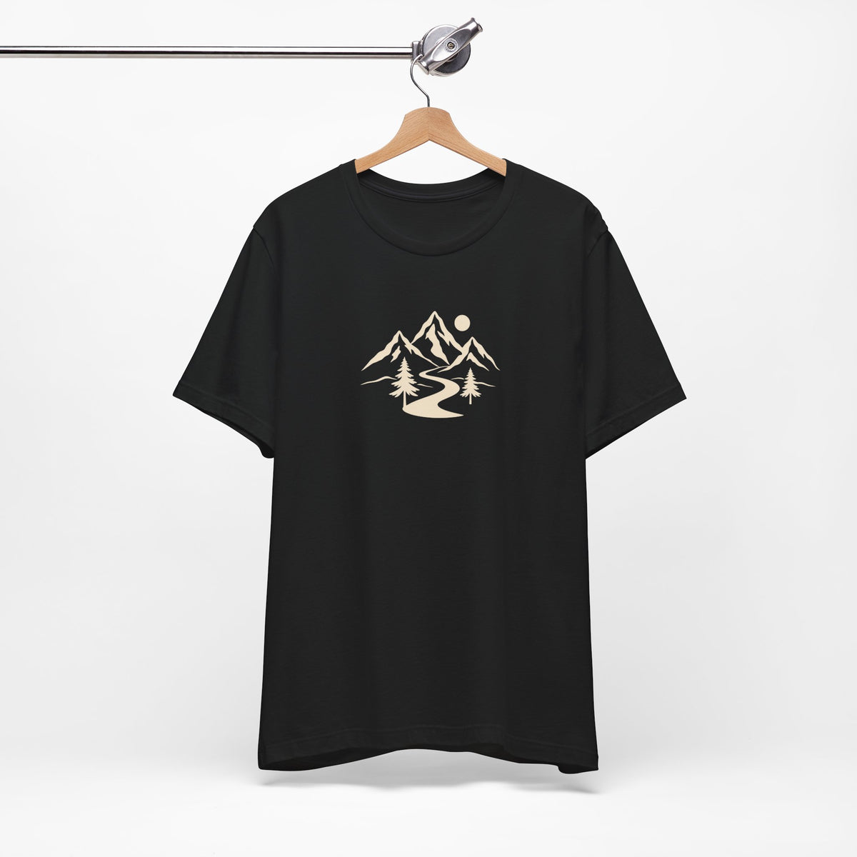Black Mountain Trail Tee hanging on a hanger, showing the cream outdoor graphic on the front.
